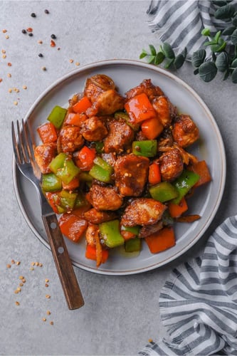Crispy coated fried chicken with pepper.