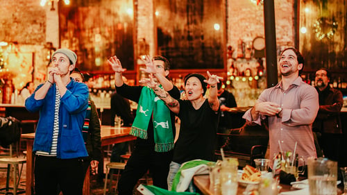 A group of fans watching World Cup games at Houston Hall in NYC.