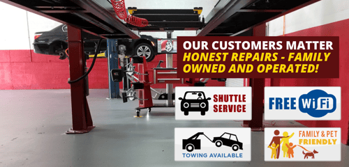 car on lift in shop