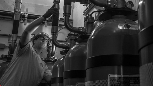 man working on a fire suppression system
