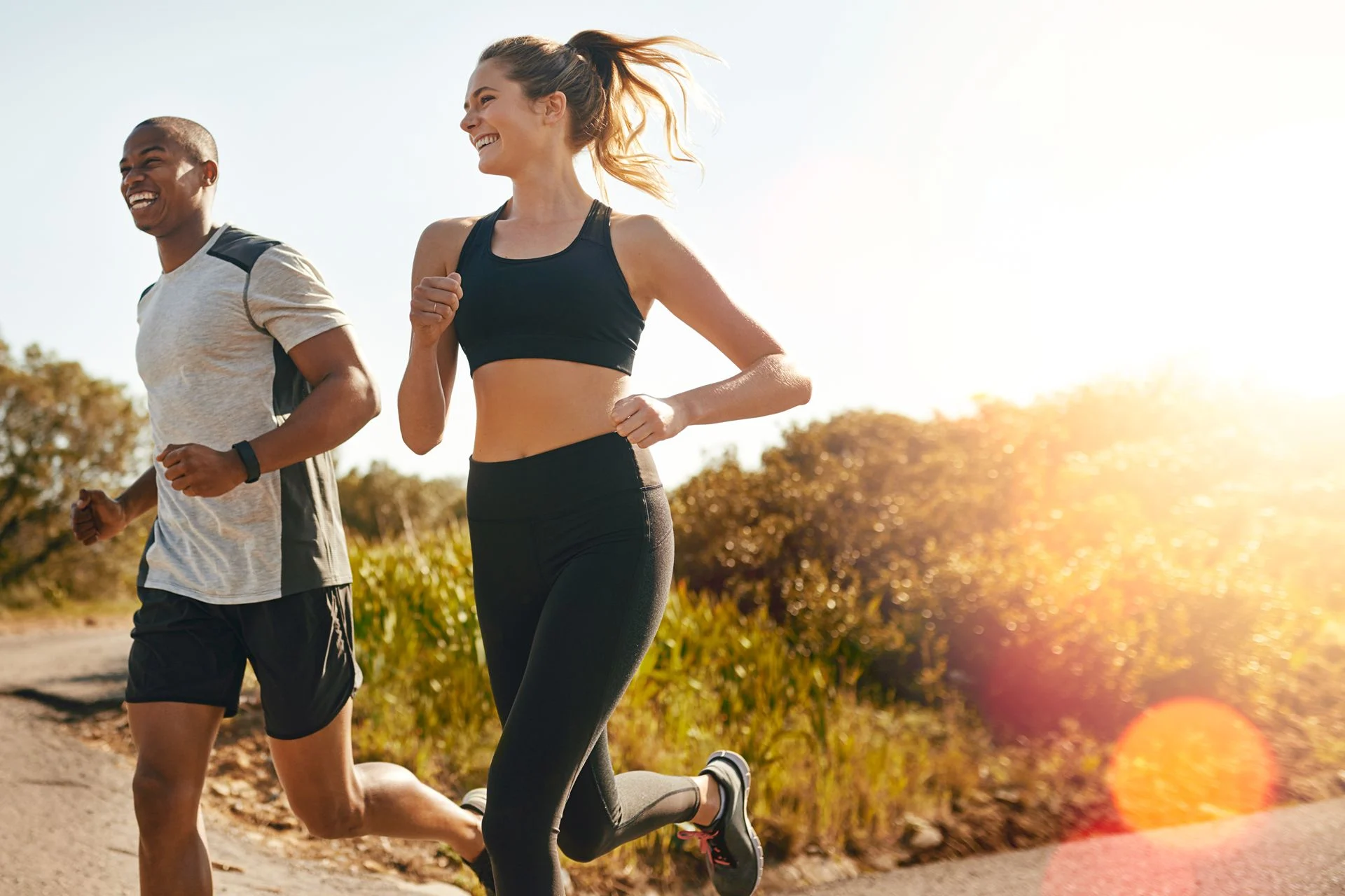 two people happily running outdoors
