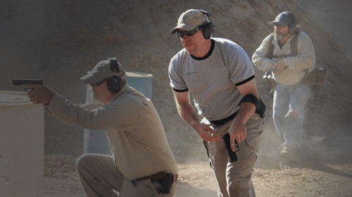 group of men shooting guns