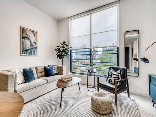 Designer Furnished Living Room with Large Windows at Sentral Wynwood