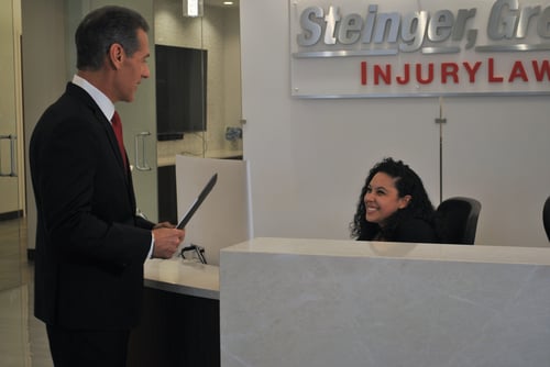 Sean Greene taking in his office Steinger, Greene & Feiner