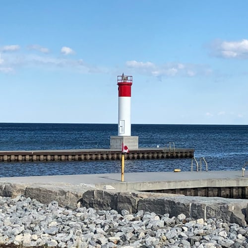View of Oakville Harbour lighthouse and pier on Lake Ontario