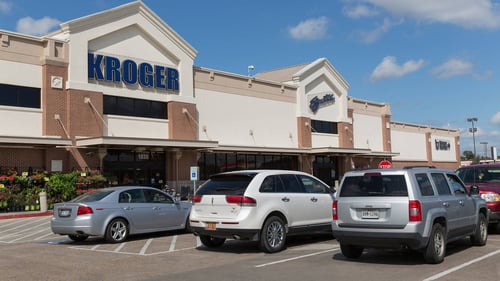 Full parking lot of Kroger on a sunny day