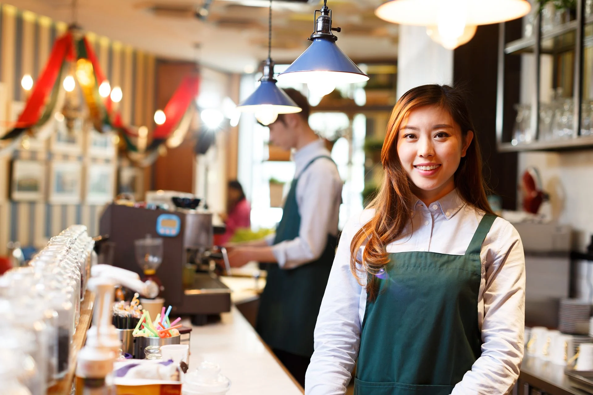 smiling barista at workplace