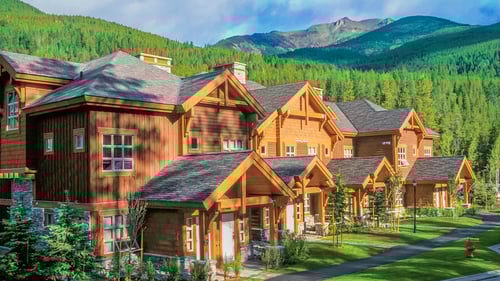 An exterior view of Embarc Panorama showcasing the resort's vicinity to the mountains.