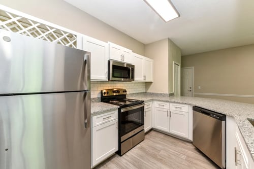 Kitchen with White Cabinets at Paradise Island Apartments in Southside Jacksonville, FL