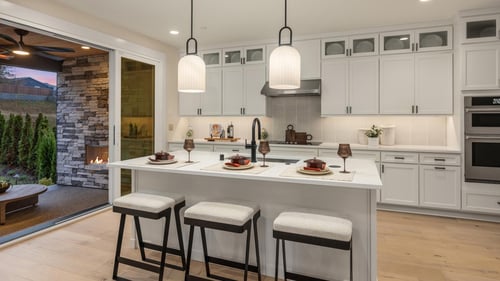 The Bonney kitchen opens to the covered patio with gas fireplace