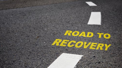 "Road To Recovery" text on a roadway