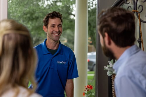 bluefrog plumber greeting homeowner