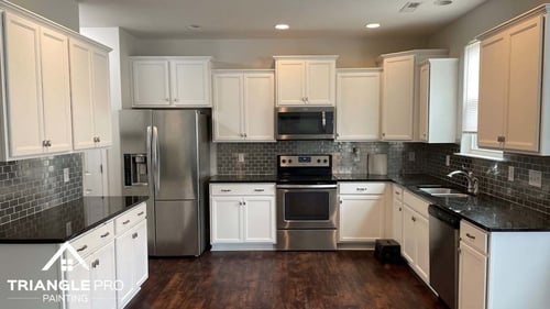 a bright, modern kitchen with factory finish on the kitchen cabinets