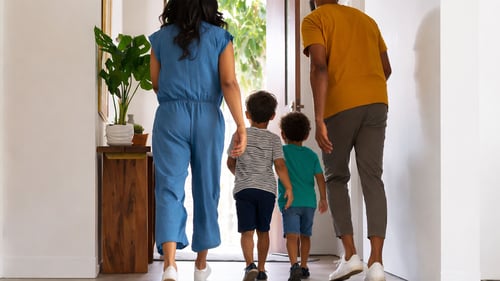 image of a family evacuating their home