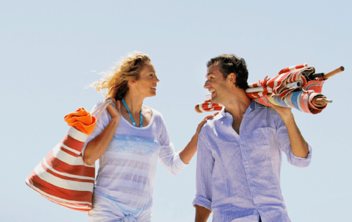 man and woman heading to the beach
