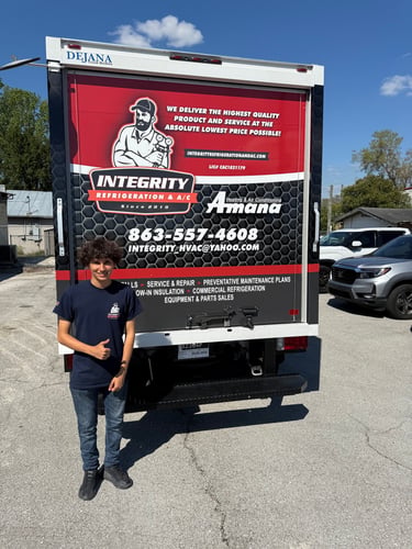Integrity Refrigeration & A/C team member with the service truck