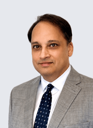 A man in a grey suit.