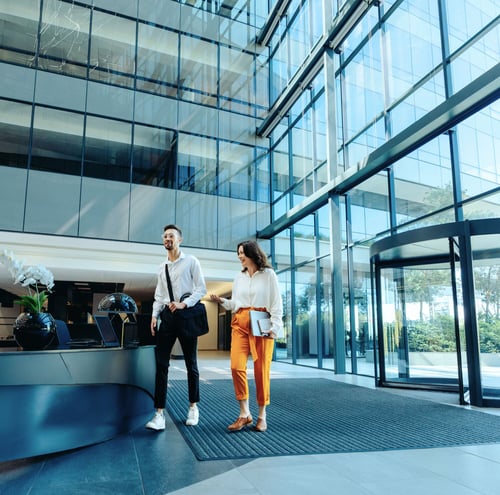Man and woman in office lobby