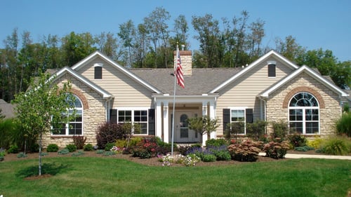 Front of large yellow house
