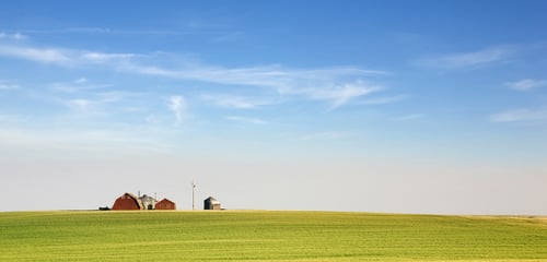 Blue sky, farmer's field, red barn