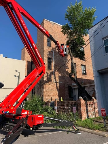 Orange lift in front of a brick building
