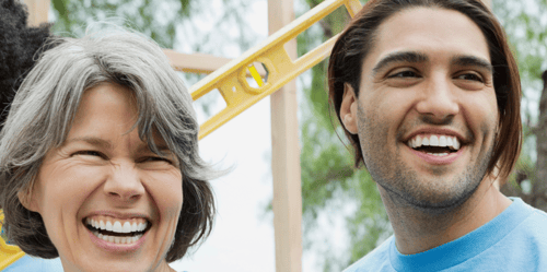 A woman and man smiling
