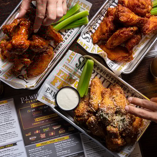 P.J. Whelihan's wings being eaten at PJ Whelihan's