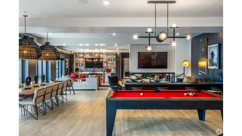 Lobby with a red pool table at Converge KC Uptown in Kansas City, MO