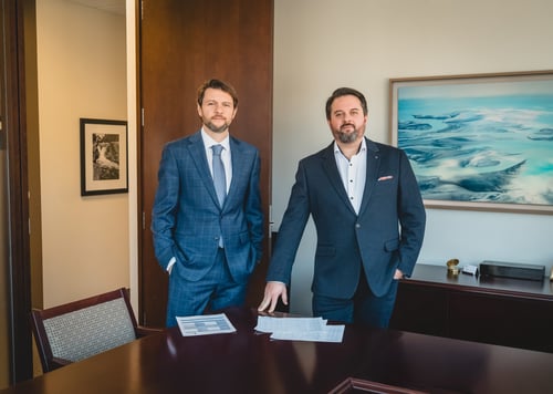 An image of 2 brothers and business partners.  conveying teamwork, diligence and trust.