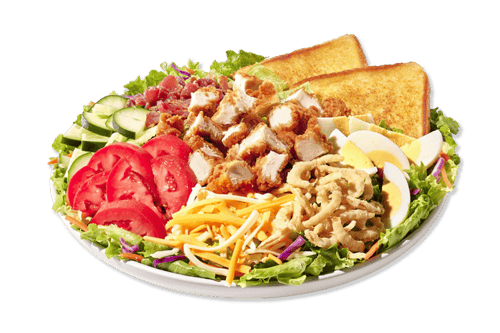 Cobb Zalad® with mixed greens with carros and red cabbage, cheddar jack cheese, bacon, hard-boiled egg, cucumbers, tomatoes, and fried onions with fried chicken.