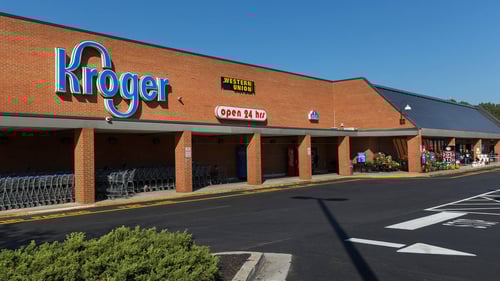 Row of shopping carts lined along entrance of Kroger at Park Plaza shopping center