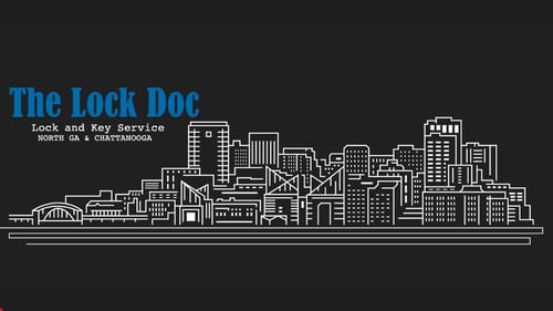 Drawing of city skyline next to The Lock Doc logo