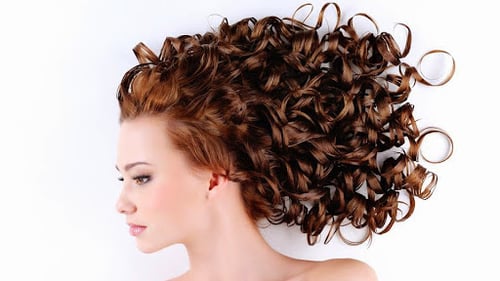 woman with long red curly hair