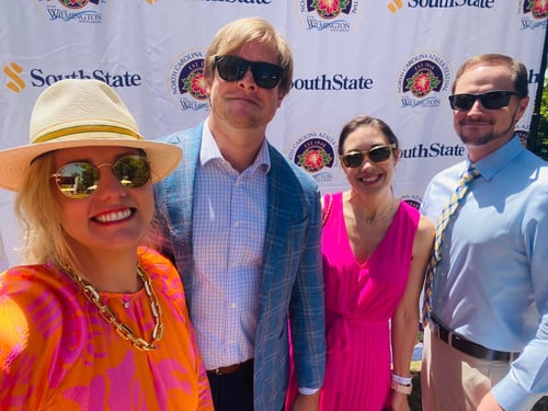Ashley-Nicole standing with husband and two friends at Azalea Festival 2023