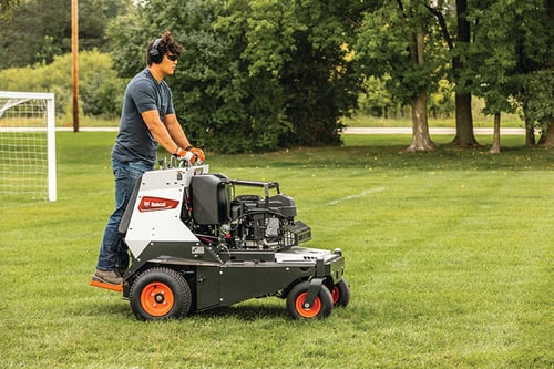 Operator easily aerates a playing field with his Bobcat ae30s Ride-on Aerator
