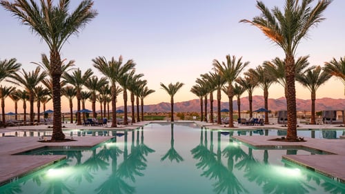 Resort-style pool with golf course and mountain views
