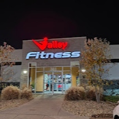 Exterior of Valley Fitness Harrisonburg illuminated at night showcasing our facility and inviting members to work out at our full-service gym and wellness center