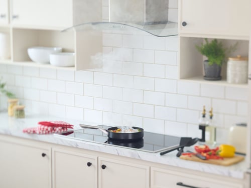 Cook top with pan cooking food