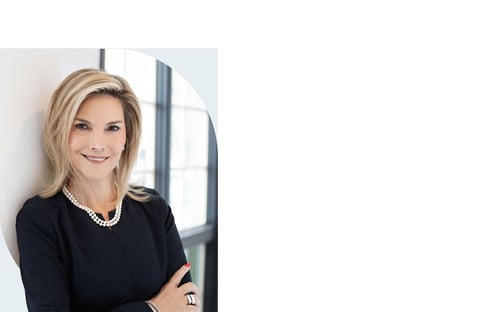 Susan Kopas standing in a bright office space.