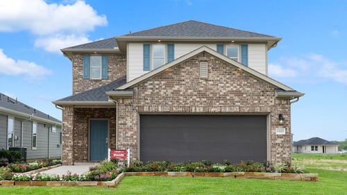 two-story family home with brown brick exterior