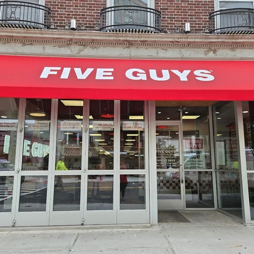 Exterior photograph of the Five Guys restaurant at 47 Easton Avenue in New Brunswick New Jersey.