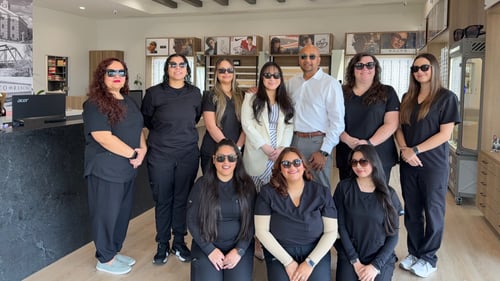 Team photo with staff wearing sunglasses from the Vision Source Katy Ranch optical department.