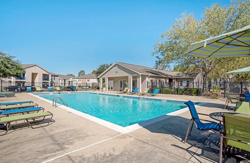 Swimming Pool & Sundeck at Grand at Pearl Apartments in Pearl, MS