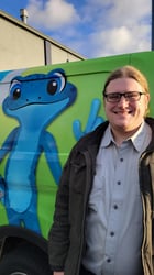 Plumber Ian Bertolini in front of a bluefrog Plumbing van