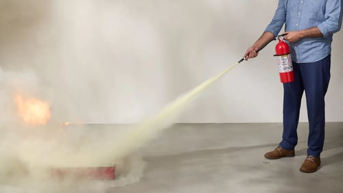 Person putting out fire