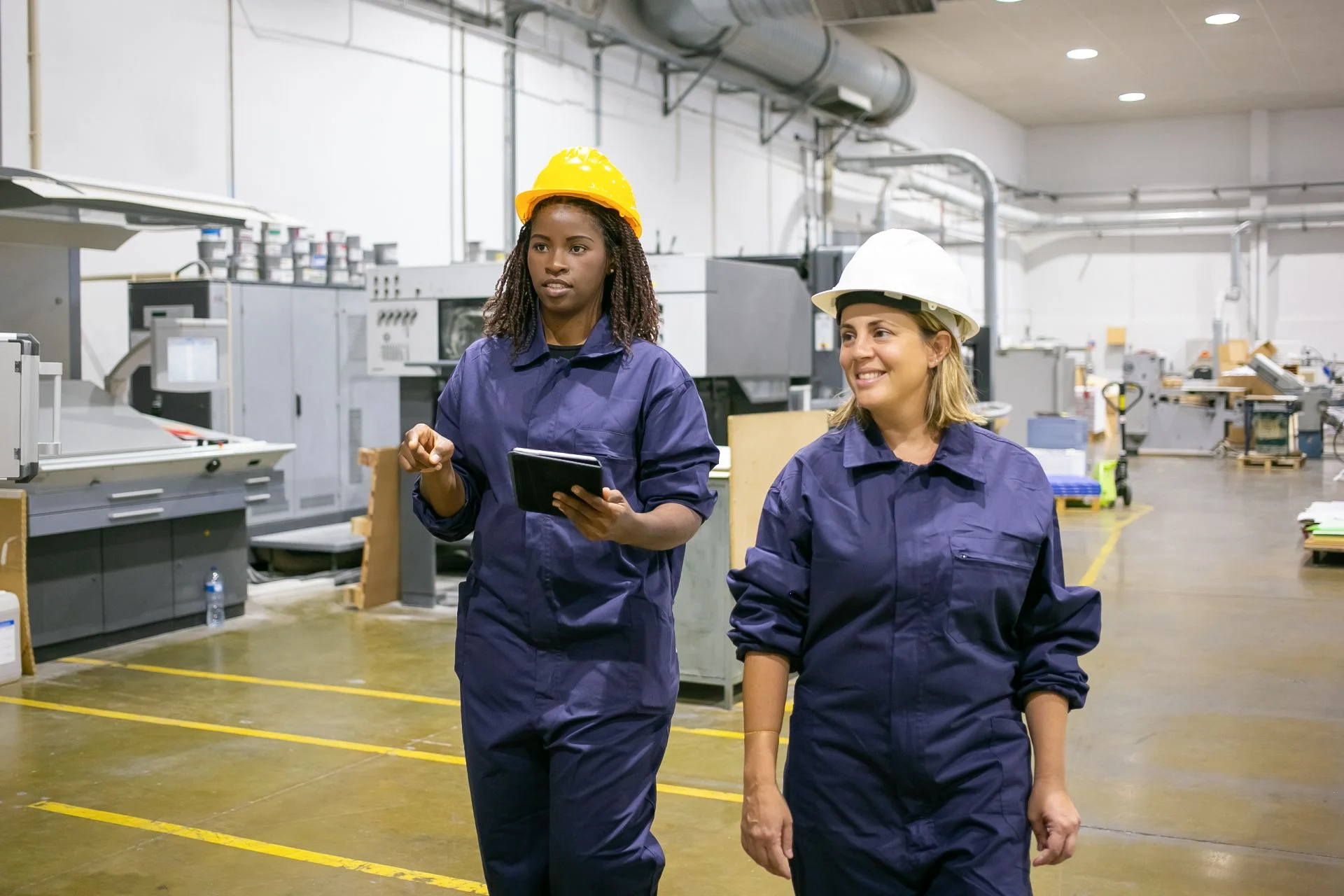 Workers on manufacturing floor wearing shoes for standing all day
