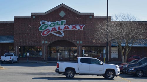 White pick up truck parked in front of Golf Galaxy at Stratford Commons shopping center