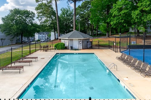 Property exterior with pool at Avondale Place Apartments, Avondale Estates, GA
