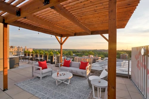 Rooftop terrace with lounge seating and furniture at 3333 Wisconsin Apartments in Washington, DC 20016