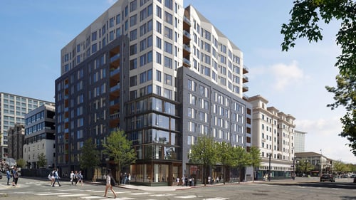 two toned apartment building at an intersection